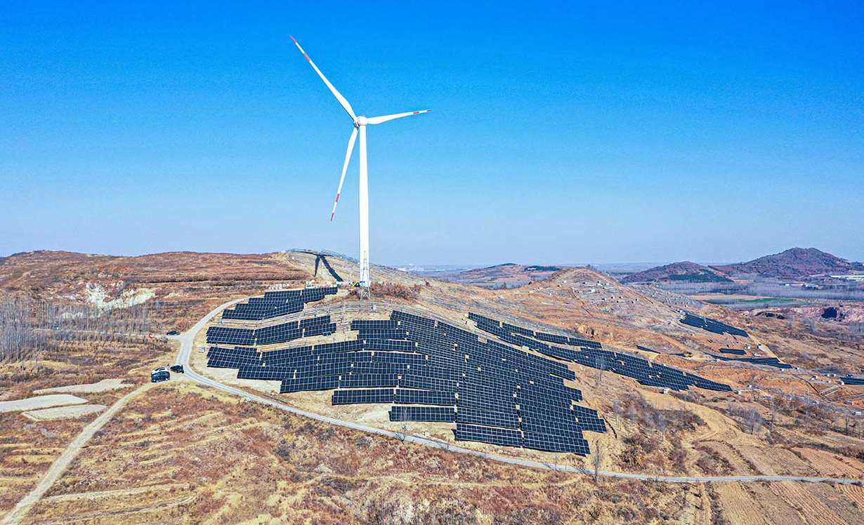 A hybrid renewable energy plant combining a large wind turbine and hillside solar panels, optimized for high-efficiency clean energy generation in a rugged terrain