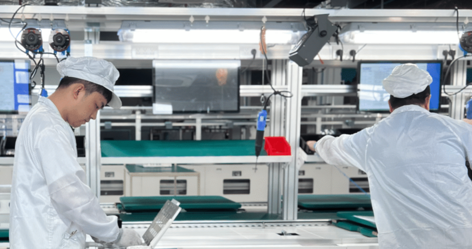 Solavita technicians working in a cleanroom manufacturing facility with advanced production lines and quality control systems.